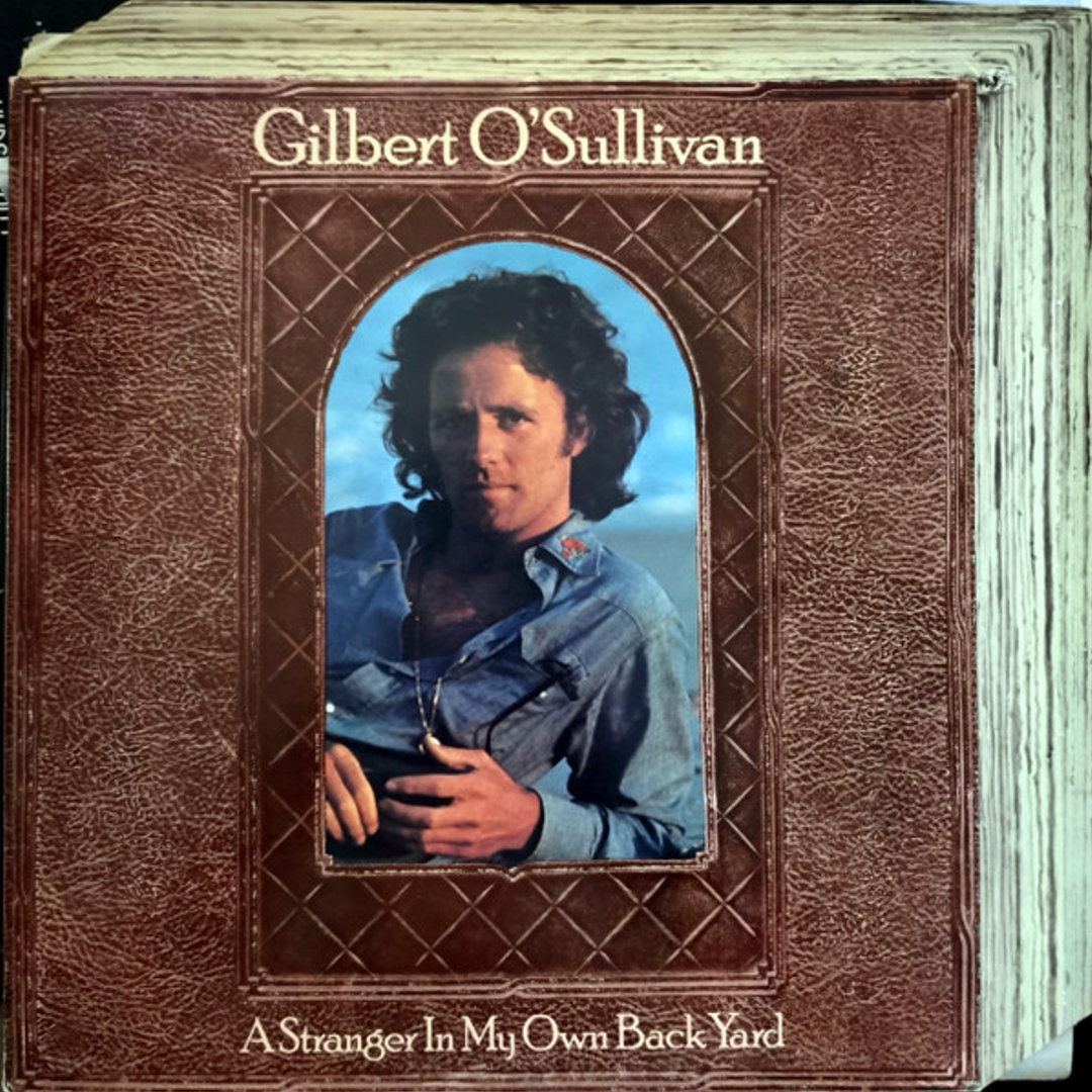 A Stranger In My Own Back Yard – Gilbert O’Sullivan