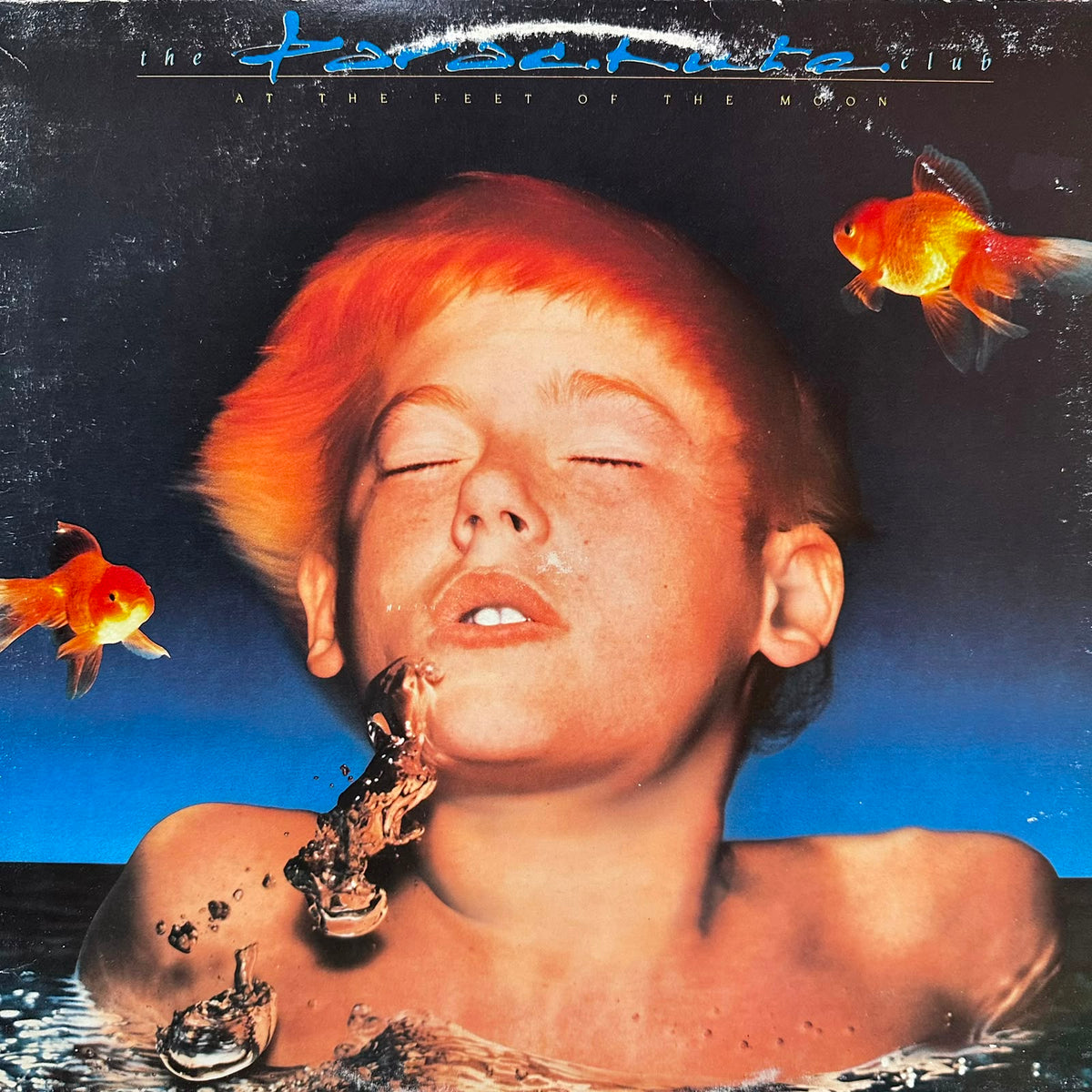 AT THE FEET OF THE MOON - THE PARACHUTE CLUB