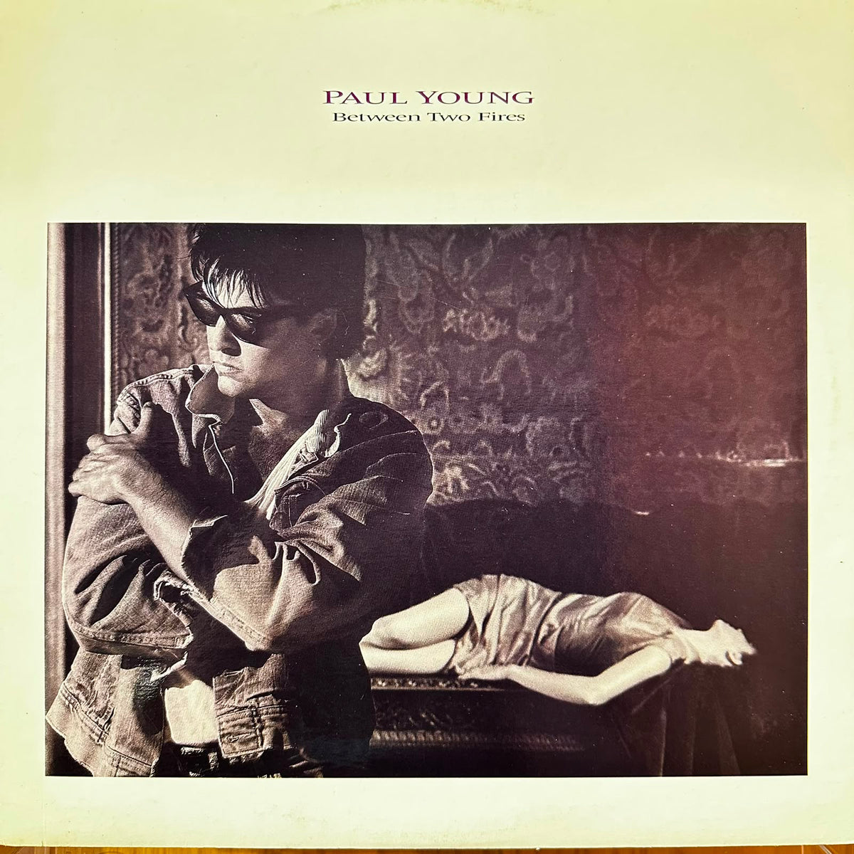 BETWEEN TWO FIRES - PAUL YOUNG